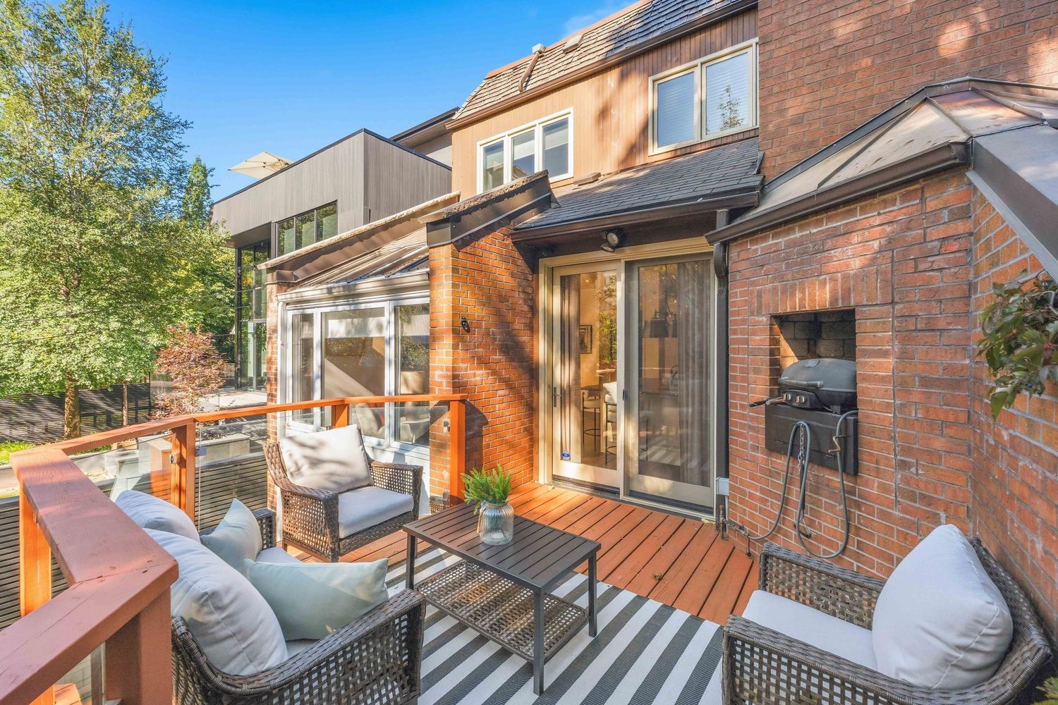 Private sun-drenched terrace with built-in barbecue and lounge seating